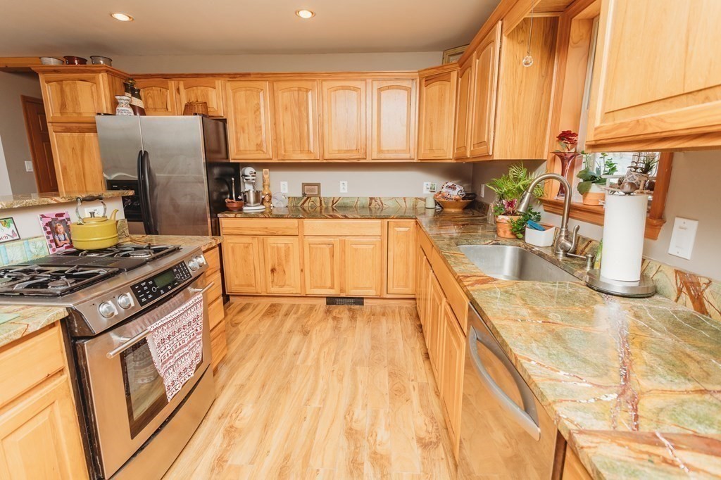 123 Davis Mine Road Rowe, MA 01367 - Photo 12 of 41 a kitchen with stainless steel appliances granite countertop a sink stove and refrigerator