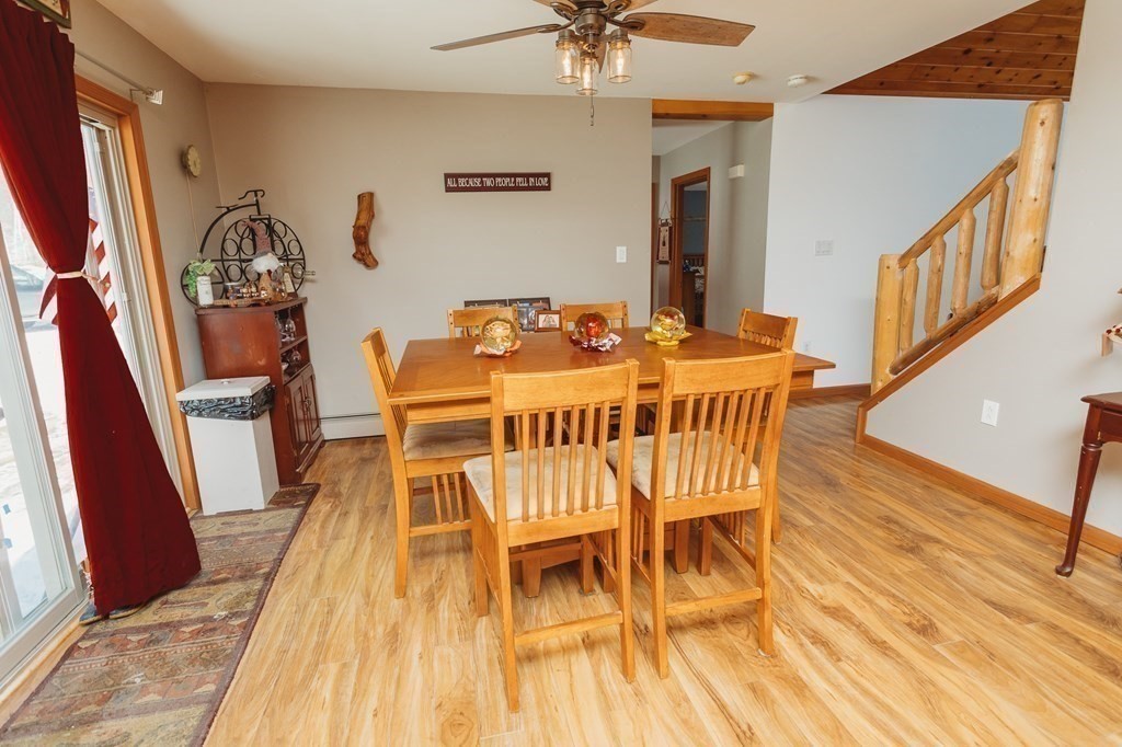 123 Davis Mine Road Rowe, MA 01367 - Photo 18 of 41 a view of a dining room with furniture and wooden floor