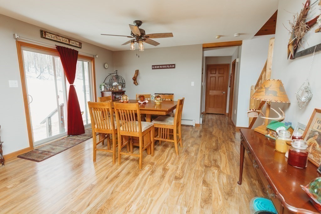 123 Davis Mine Road Rowe, MA 01367 - Photo 19 of 41 a view of a dining room with furniture and wooden floor