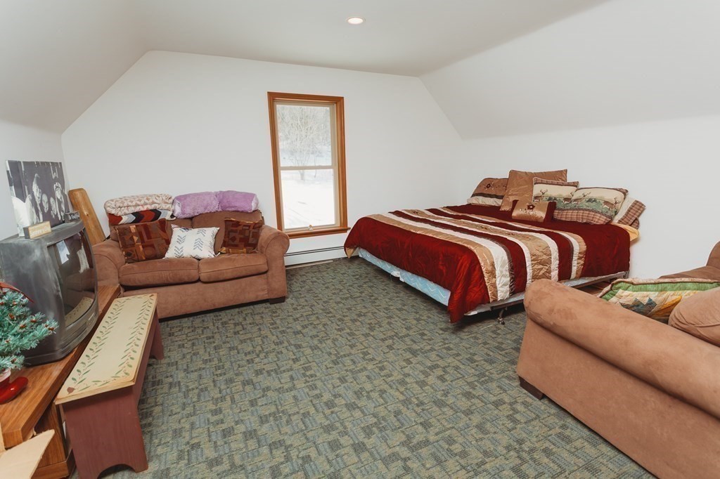 123 Davis Mine Road Rowe, MA 01367 - Photo 20 of 41 a bedroom with furniture and a couch
