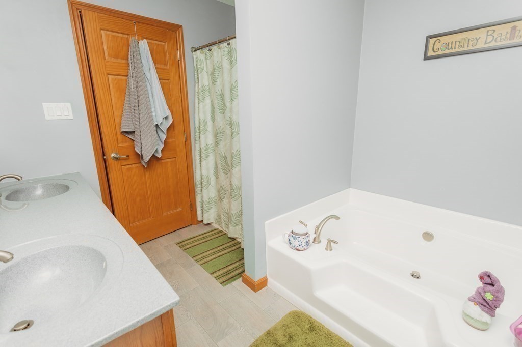 123 Davis Mine Road Rowe, MA 01367 - Photo 25 of 41 a bathroom with a tub sink and mirror