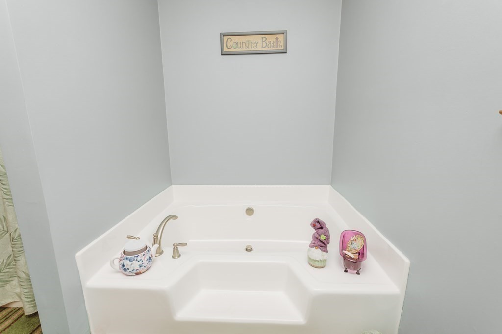 123 Davis Mine Road Rowe, MA 01367 - Photo 26 of 41 a white bath tub sitting next to a white wall