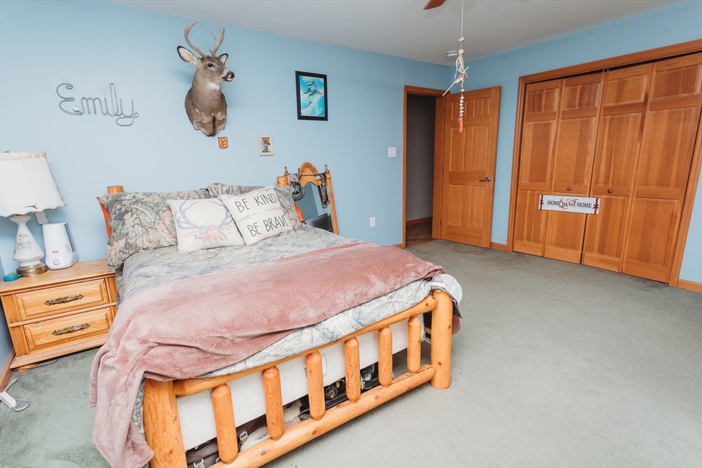 123 Davis Mine Road Rowe, MA 01367 - Photo 27 of 41 a bedroom with a bed and a window