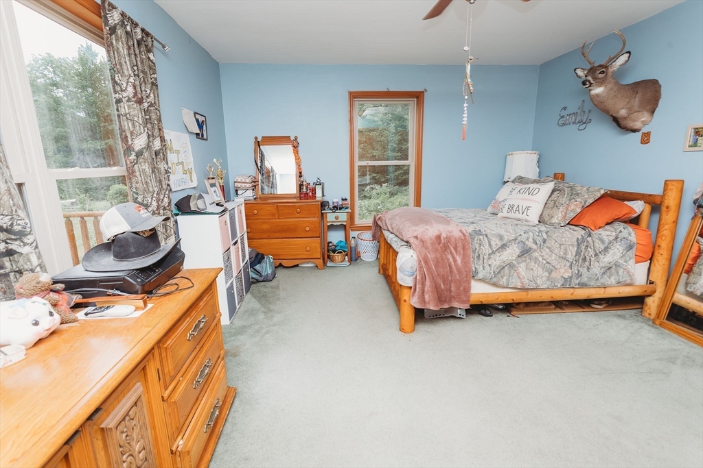 123 Davis Mine Road Rowe, MA 01367 - Photo 28 of 41 a bedroom with furniture and a window