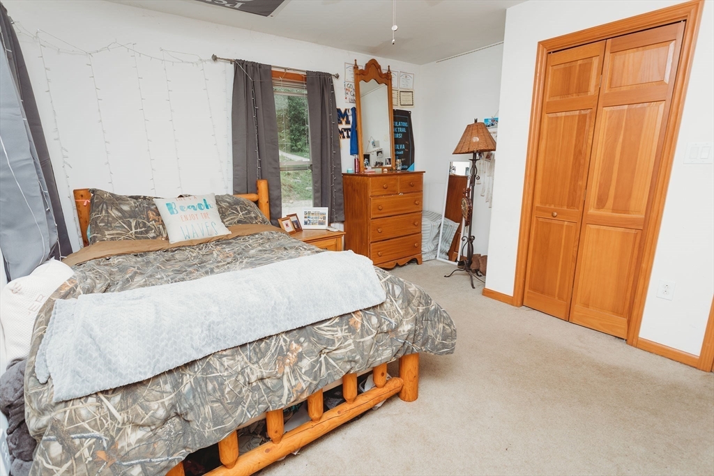 123 Davis Mine Road Rowe, MA 01367 - Photo 31 of 41 a bedroom with a bed and a window