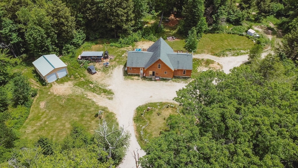 123 Davis Mine Road Rowe, MA 01367 - Photo 36 of 41 an aerial view of a house with swimming pool and garden