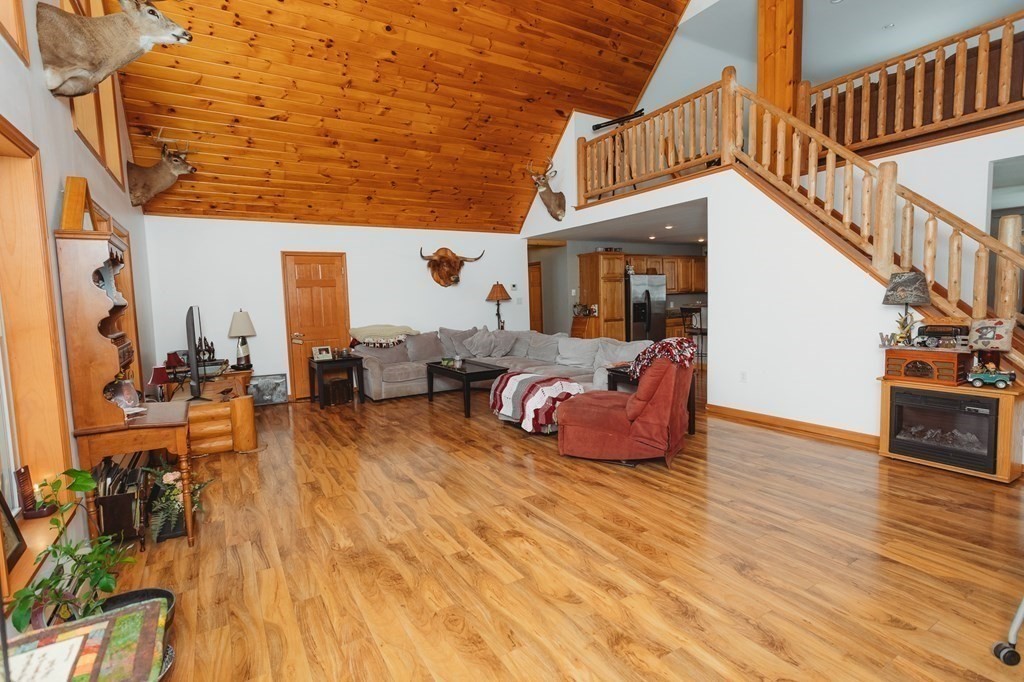 123 Davis Mine Road Rowe, MA 01367 - Photo 5 of 41 a view of living room kitchen with furniture and wooden floor