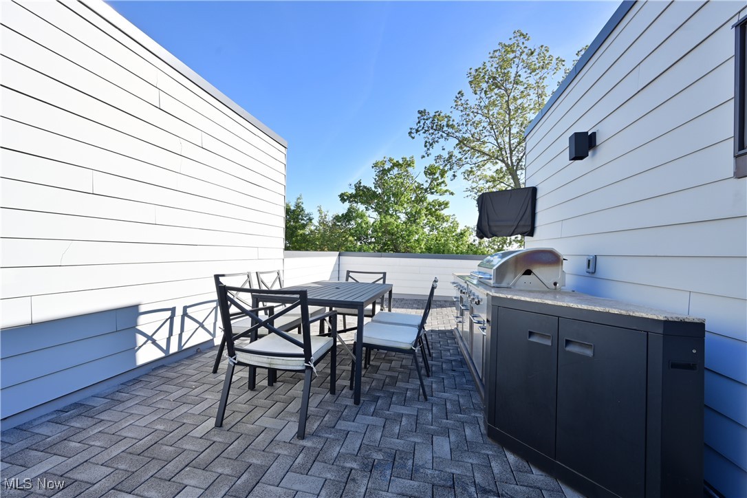 18875 Riversouth Fairview Park, Unit 30 Cleveland, OH 44126 - Photo 27 of 39 View of patio featuring outdoor dining space and area for grilling
