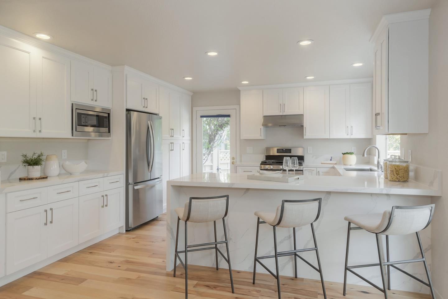 305 Windmill Park Lane Mountain View, CA 94043 - Photo 15 of 28 a kitchen with stainless steel appliances granite countertop a refrigerator and microwave
