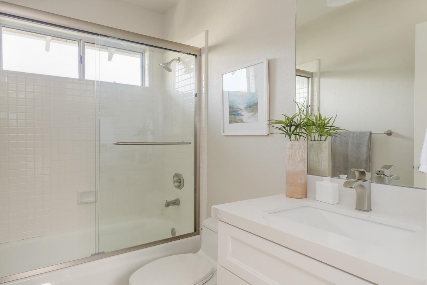 305 Windmill Park Lane Mountain View, CA 94043 - Photo 18 of 28 a bathroom with a granite countertop sink a toilet and shower