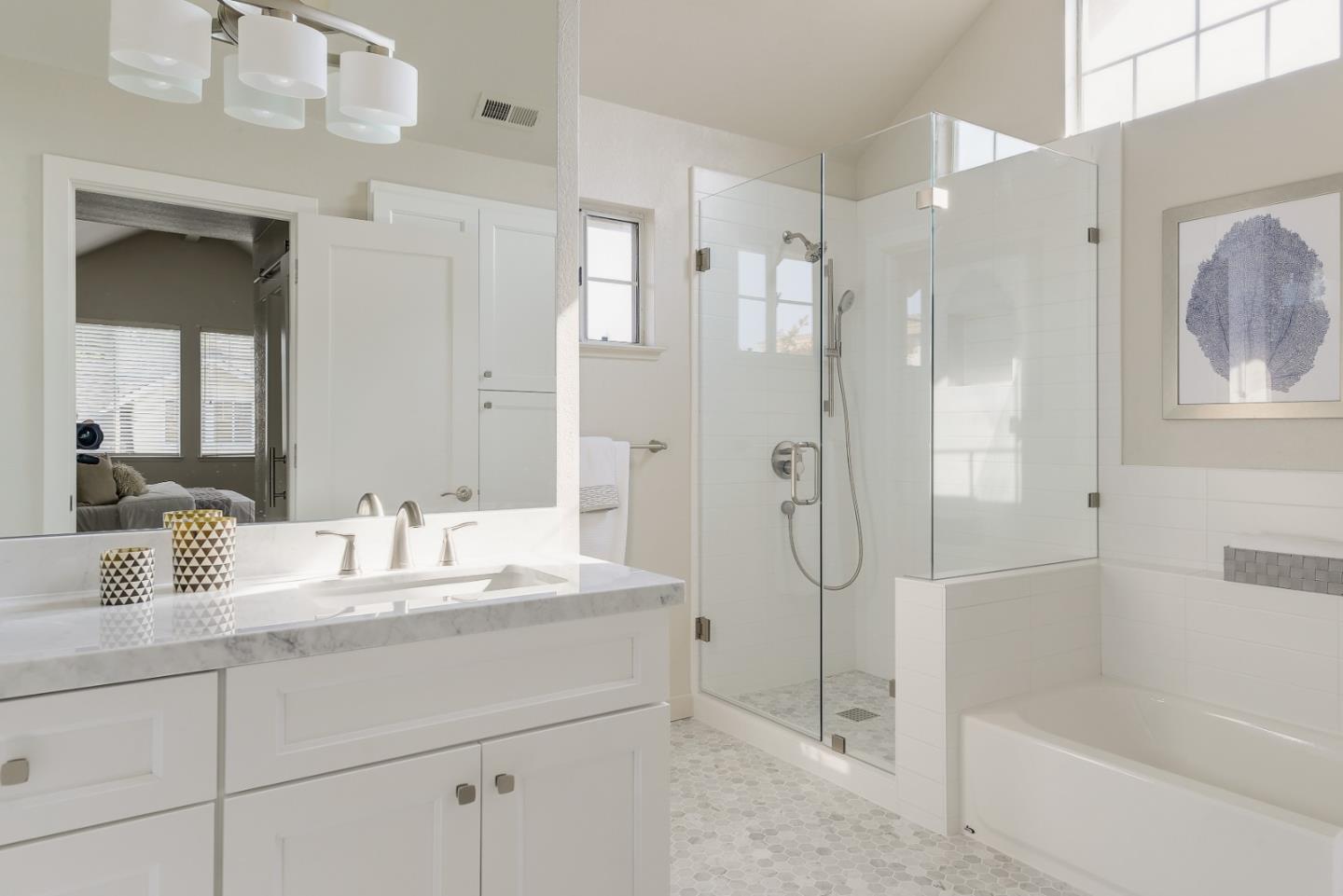 305 Windmill Park Lane Mountain View, CA 94043 - Photo 22 of 28 a bathroom with a granite countertop sink mirror bathtub and shower