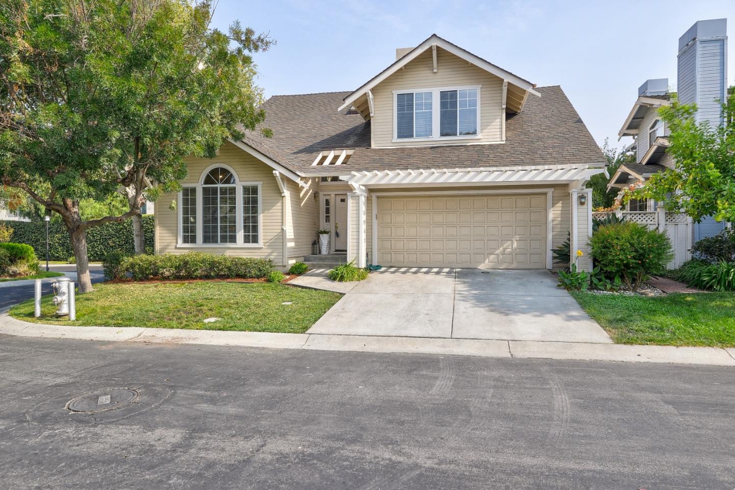 305 Windmill Park Lane Mountain View, CA 94043 - Photo 4 of 28 a front view of a house with a yard and garage