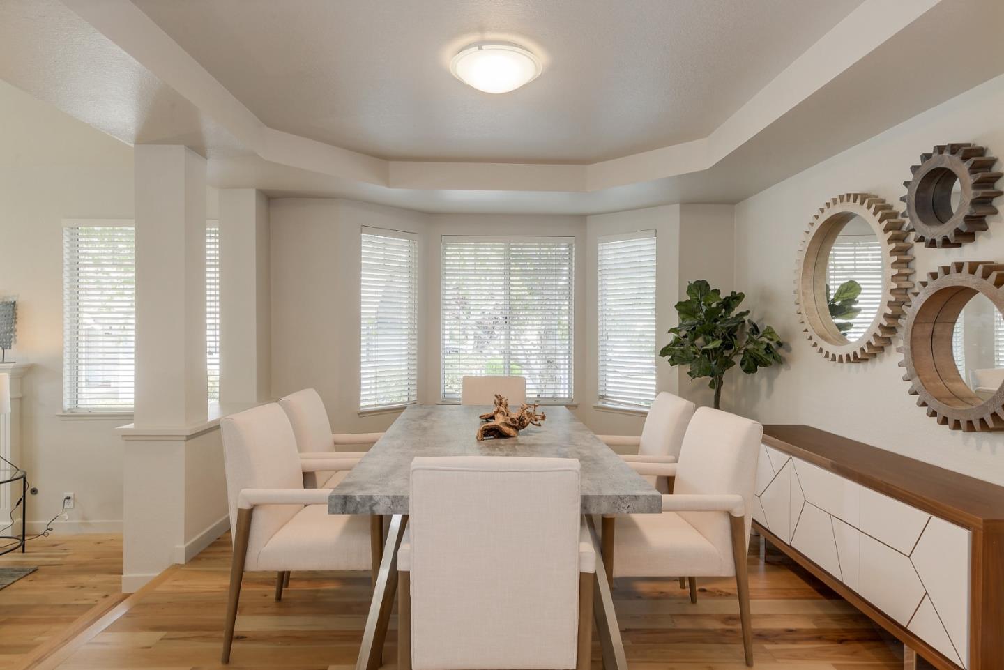 305 Windmill Park Lane Mountain View, CA 94043 - Photo 10 of 28 a dining room with furniture window and wooden floor