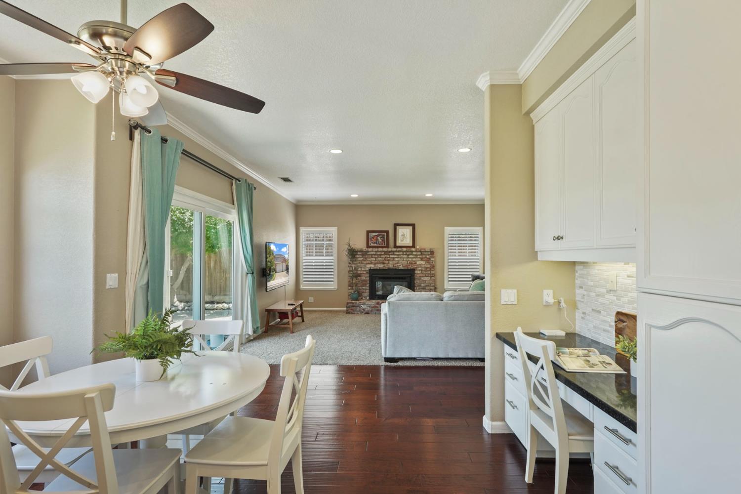 18432 Ironstone Street Woodbridge, CA 95258 - Photo 19 of 50 The kitchen/nook is open to the family room with fireplace.
