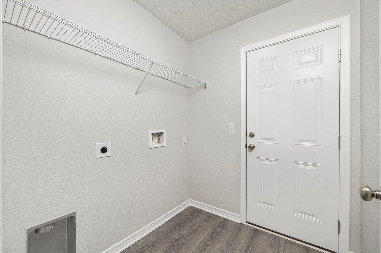 3161 Haskell Langley Road Crestview, FL 32539 - Photo 15 of 36 a view of a hallway with wooden floor