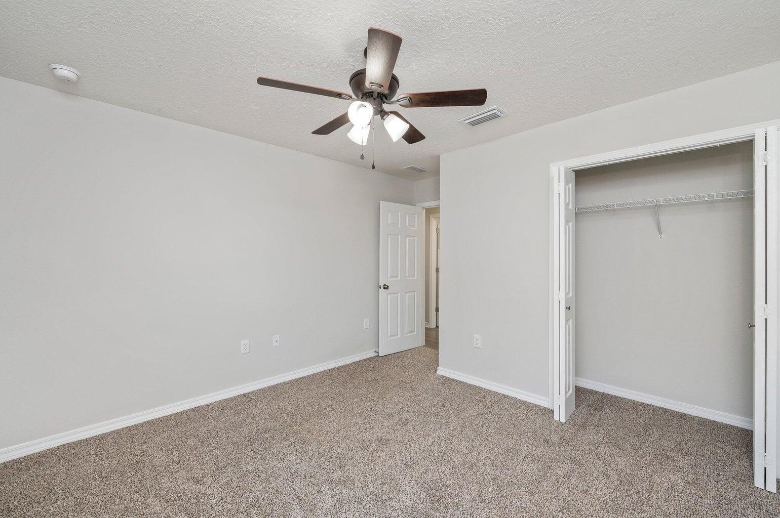 3161 Haskell Langley Road Crestview, FL 32539 - Photo 19 of 36 an empty room with chandelier fan