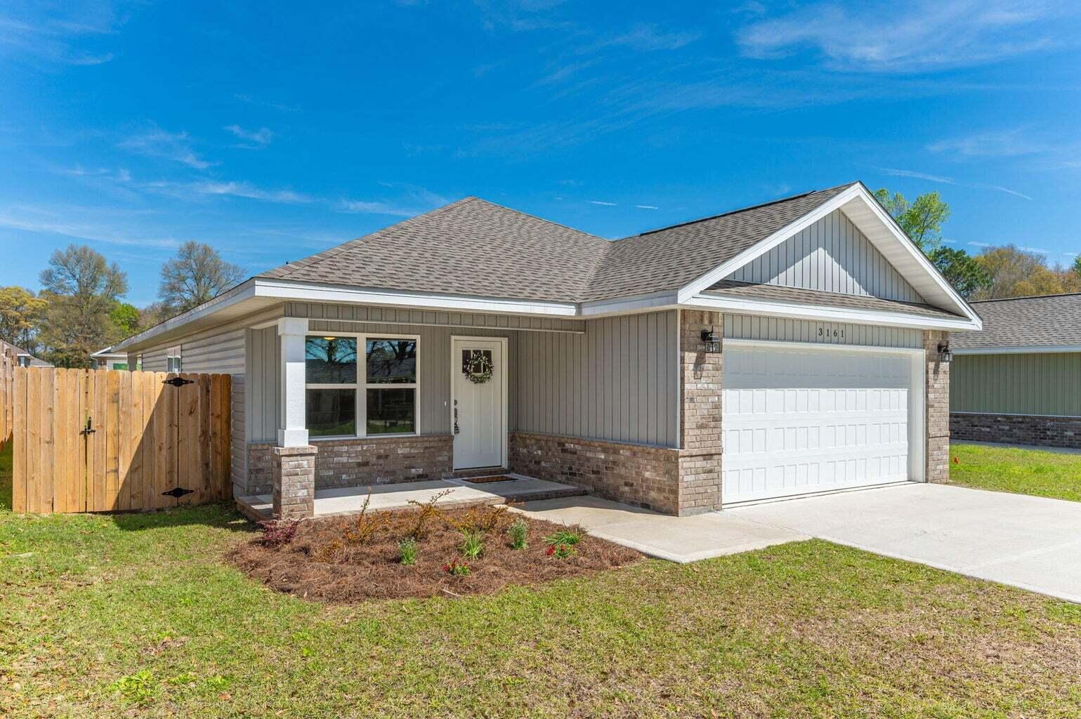 3161 Haskell Langley Road Crestview, FL 32539 - Photo 2 of 36 a front view of a house with a yard