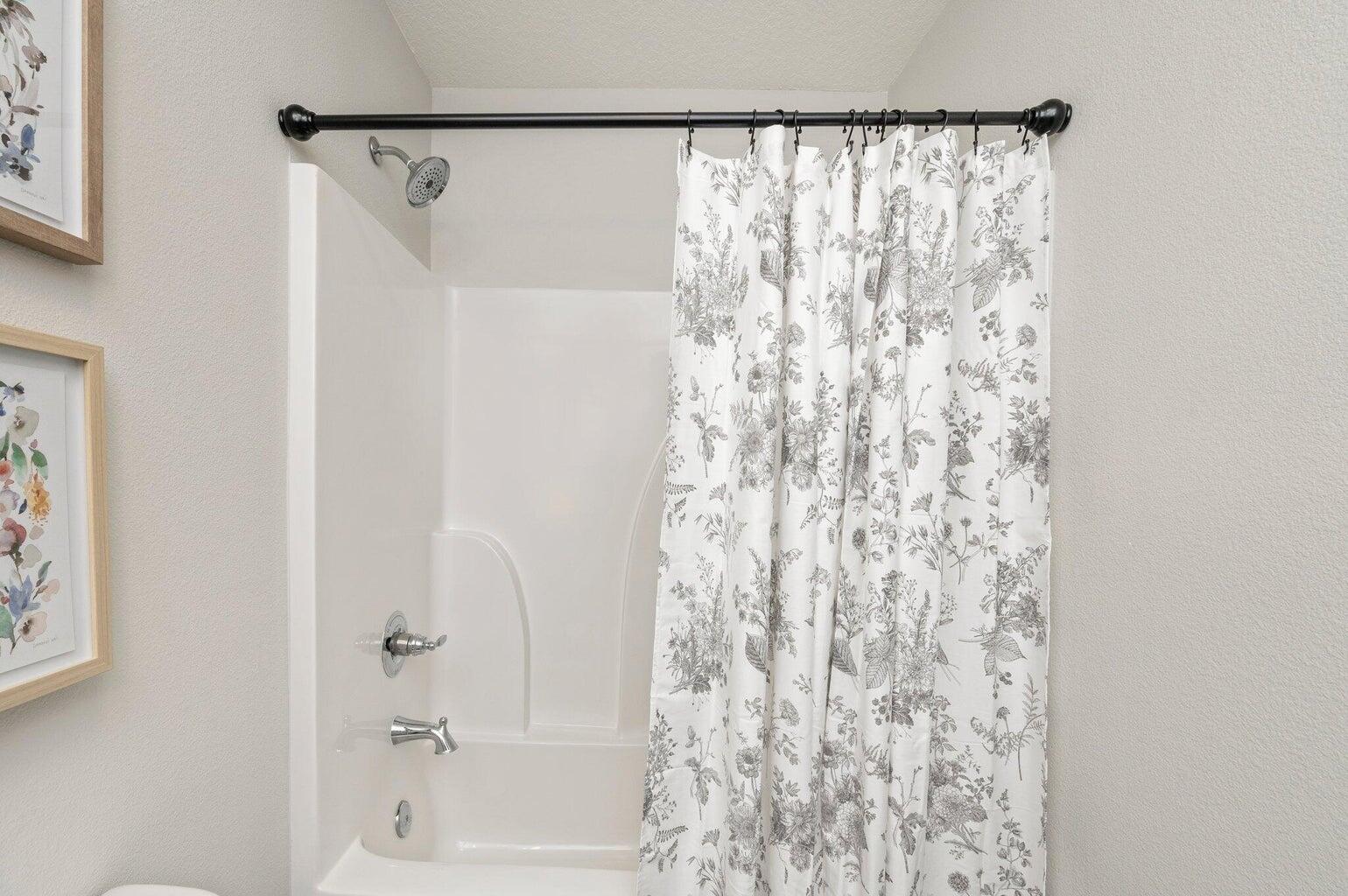 3161 Haskell Langley Road Crestview, FL 32539 - Photo 21 of 36 a bathroom with a shower curtain and a curtain