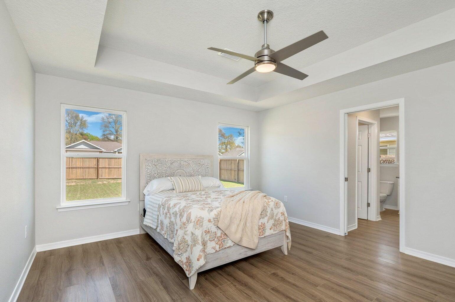 3161 Haskell Langley Road Crestview, FL 32539 - Photo 22 of 36 a bedroom with a bed and a window