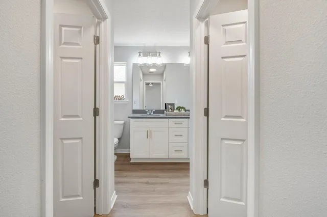 a bathroom with a shower and a sink