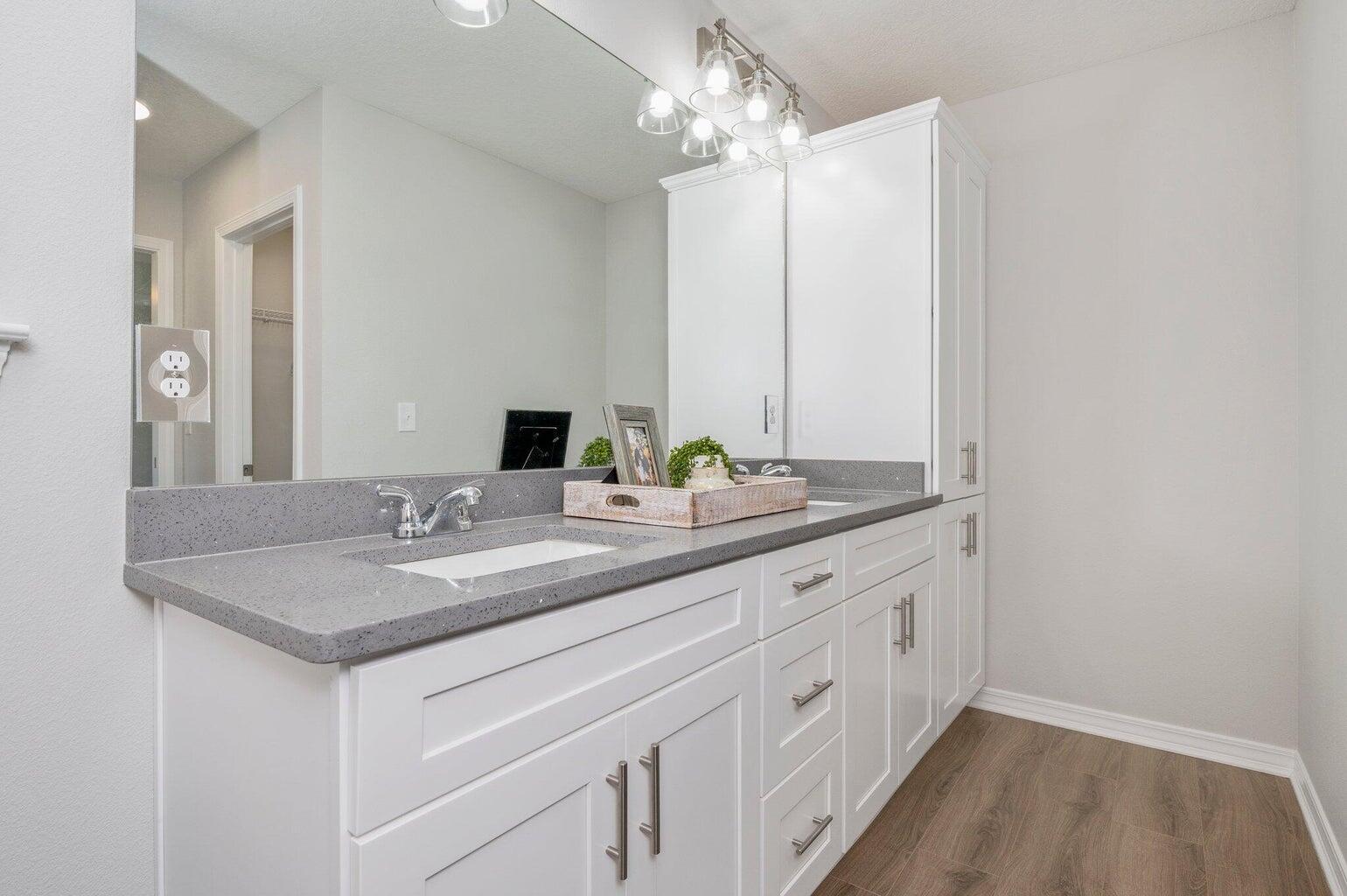 3161 Haskell Langley Road Crestview, FL 32539 - Photo 25 of 36 a bathroom with a granite countertop sink and a mirror
