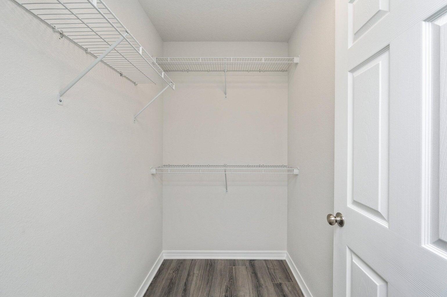 3161 Haskell Langley Road Crestview, FL 32539 - Photo 29 of 36 a view of walk in closet with empty racks
