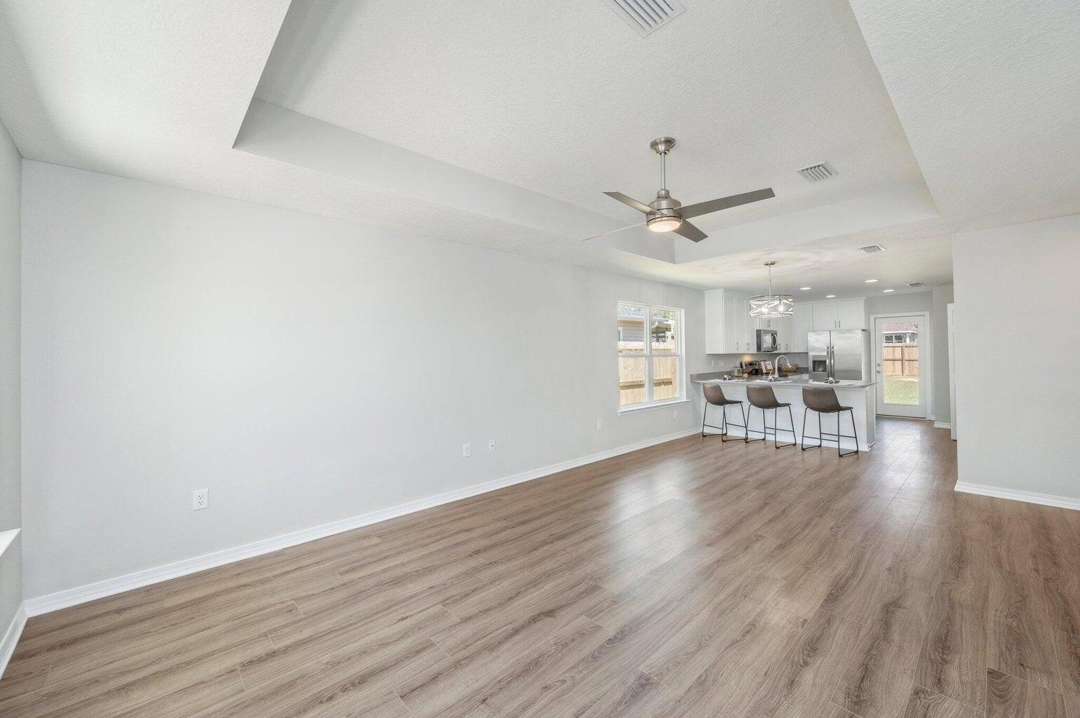 3161 Haskell Langley Road Crestview, FL 32539 - Photo 6 of 36 a view of a livingroom with furniture and a ceiling fan