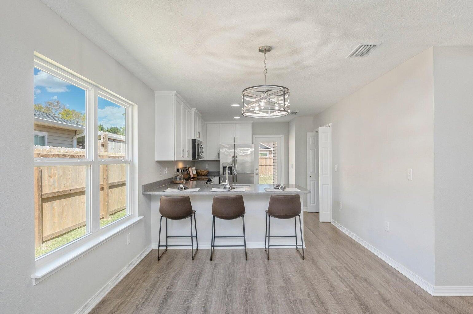 3161 Haskell Langley Road Crestview, FL 32539 - Photo 7 of 36 a view of a livingroom with furniture window and wooden floor