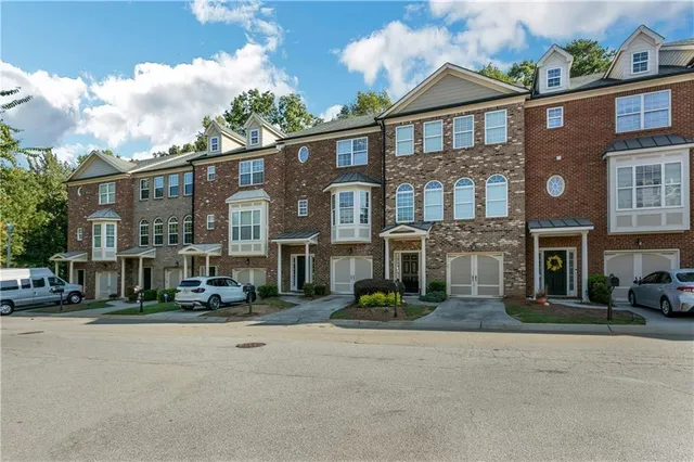 a city street lined with buildings and cars