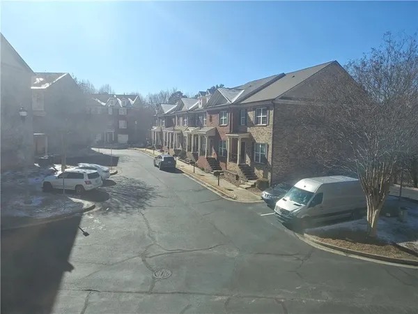 a view of a street with a building in the background
