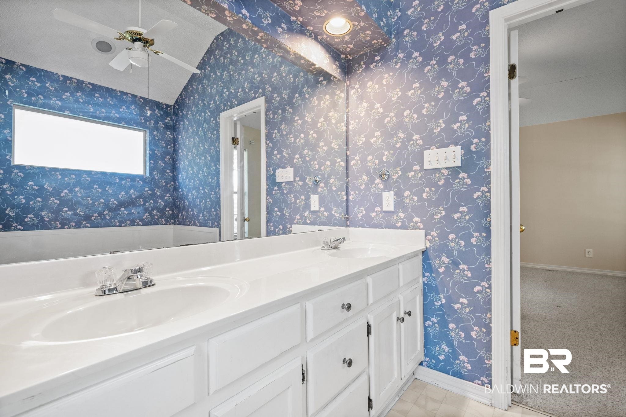 1340 Wellsley Court Mobile, AL 36695 - Photo 33 of 37 Bathroom featuring double vanity, vaulted ceiling, wallpapered walls, and a ceiling fan