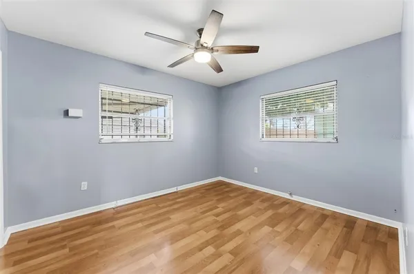 a view of room with window and ceiling fan