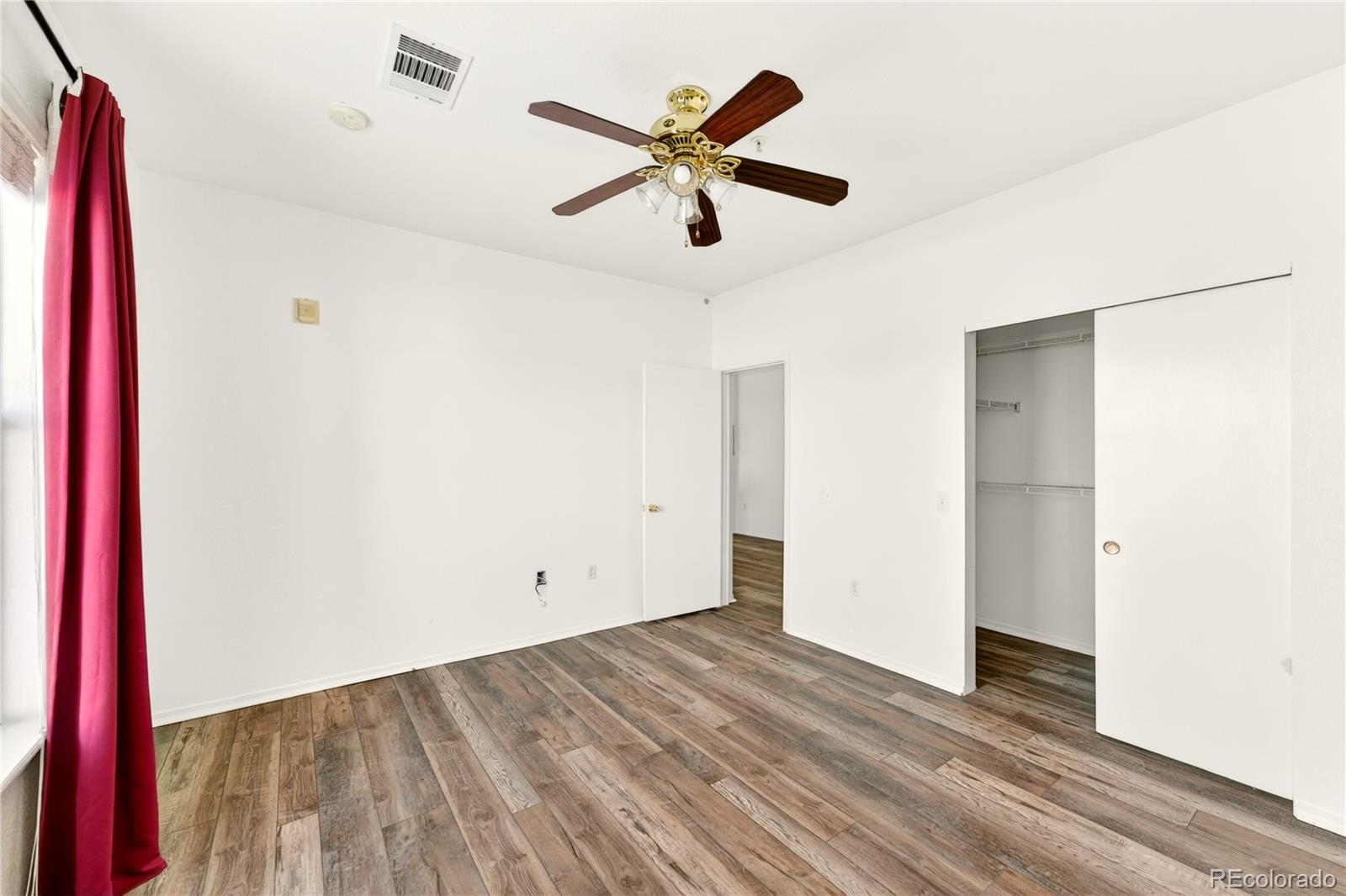 18929 East Warren Circle, Unit C205 Aurora, CO 80013 - Photo 26 of 46 a view of empty room with wooden floor