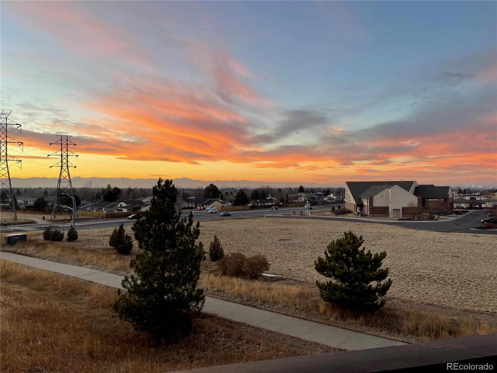 18929 East Warren Circle, Unit C205 Aurora, CO 80013 - Photo 3 of 46 a view of a terrace with chairs