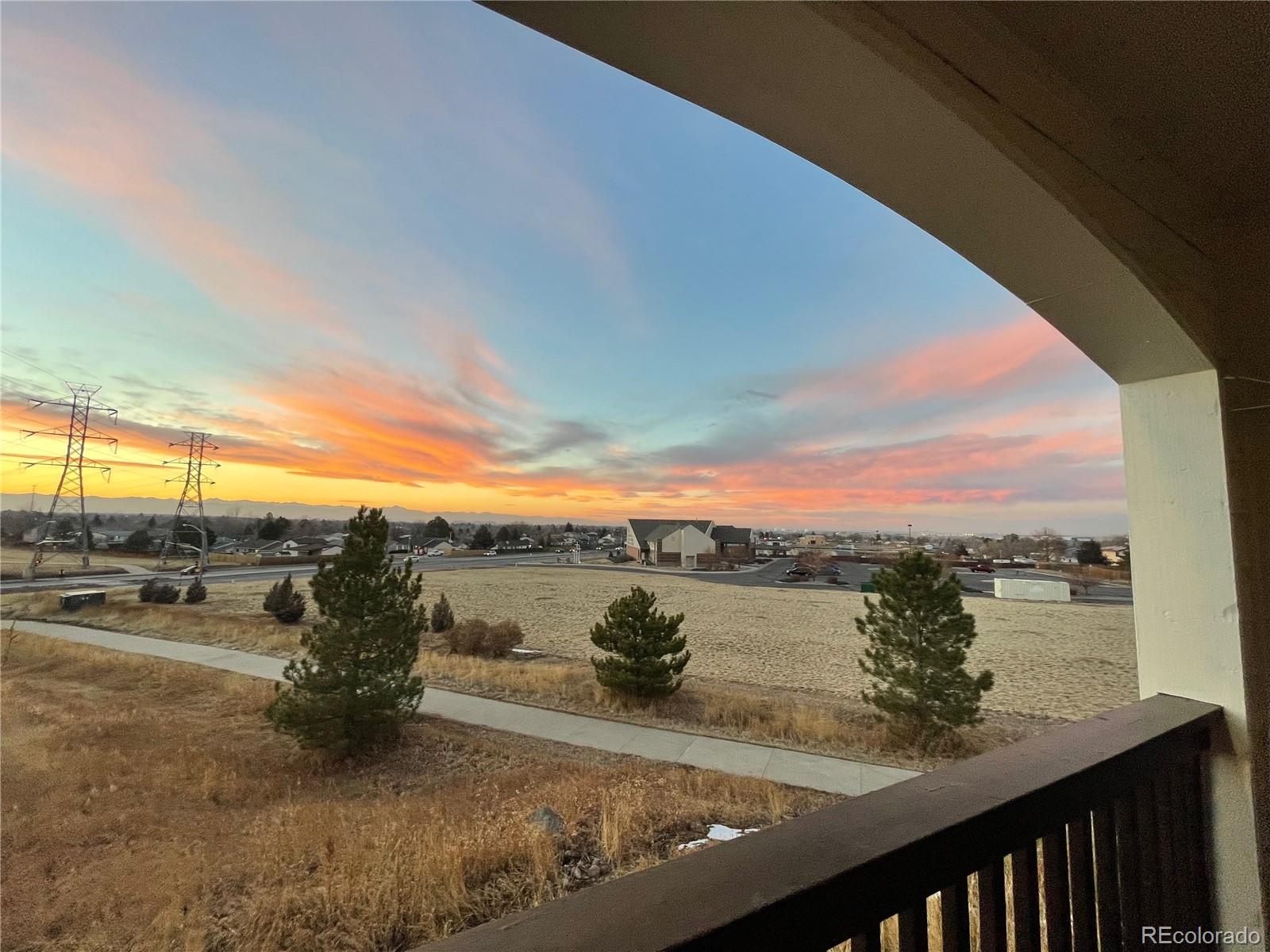 18929 East Warren Circle, Unit C205 Aurora, CO 80013 - Photo 42 of 46 a view of a street with an ocean view