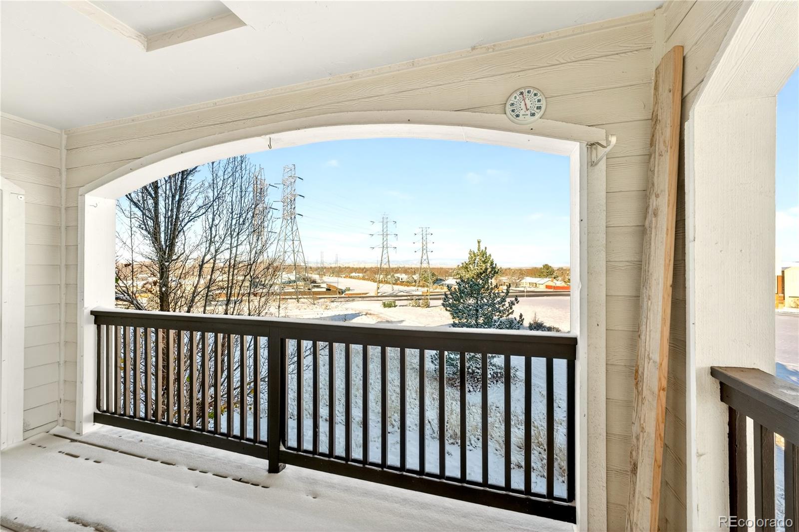 18929 East Warren Circle, Unit C205 Aurora, CO 80013 - Photo 44 of 46 a view of a balcony with wooden floor