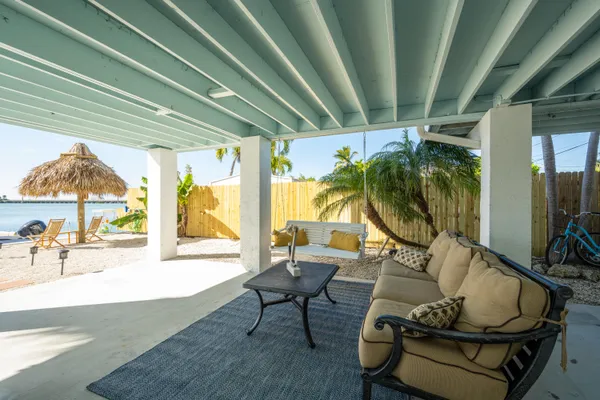a kitchen with stainless steel appliances white cabinets and a stove top oven