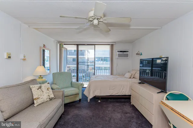 a bedroom with a bed and a couch