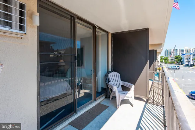 a chair and table in a balcony