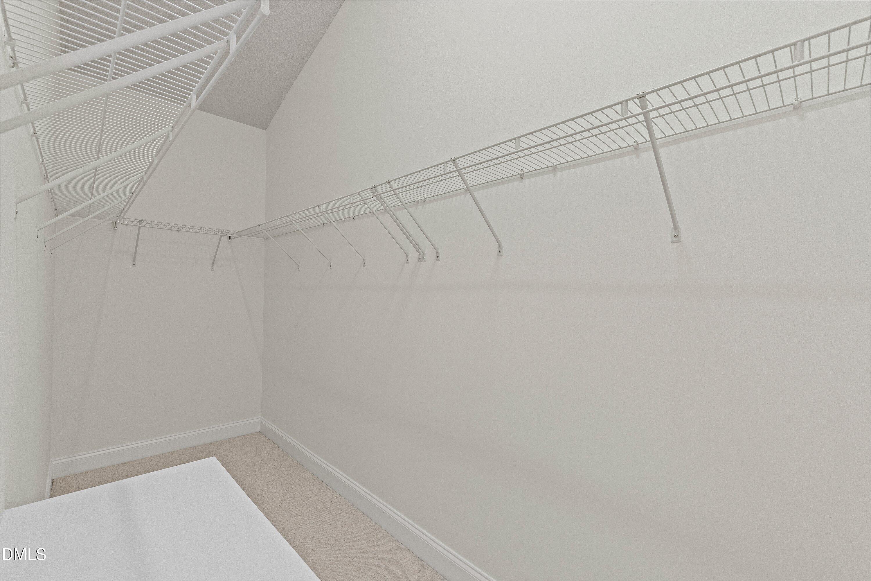 105 Rockport Ridge Way Cary, NC 27519 - Photo 32 of 43 a view of a room with racks on the wall