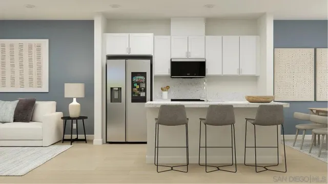 a kitchen with cabinets a sink and a stove
