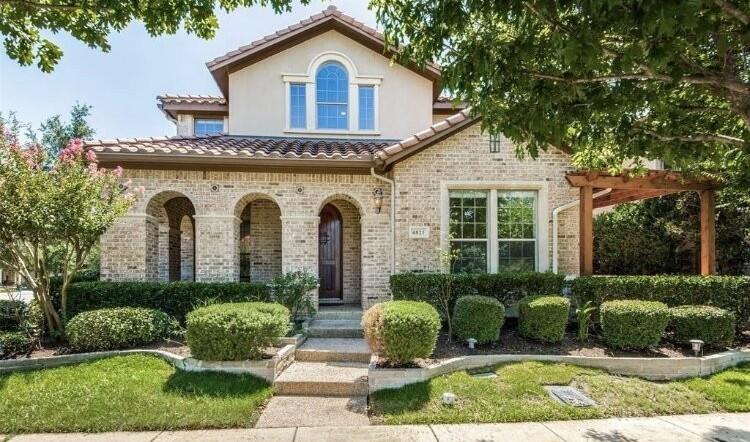 6821 Camino Rio Irving, TX 75039 - Photo 1 of 20 a front view of a house with a yard