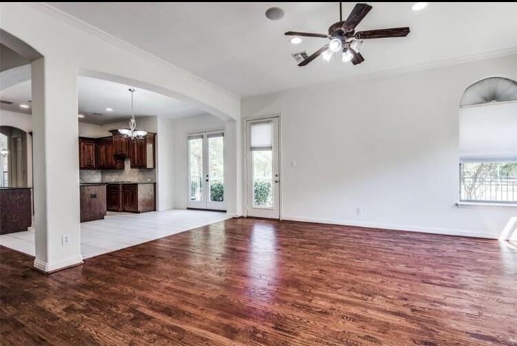 6821 Camino Rio Irving, TX 75039 - Photo 10 of 20 a view of an empty room with a window and a kitchen
