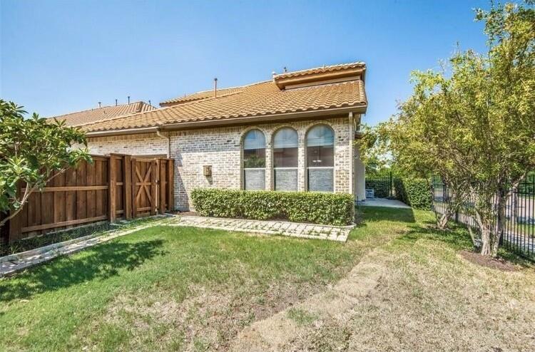 6821 Camino Rio Irving, TX 75039 - Photo 18 of 20 a front view of a house with a yard