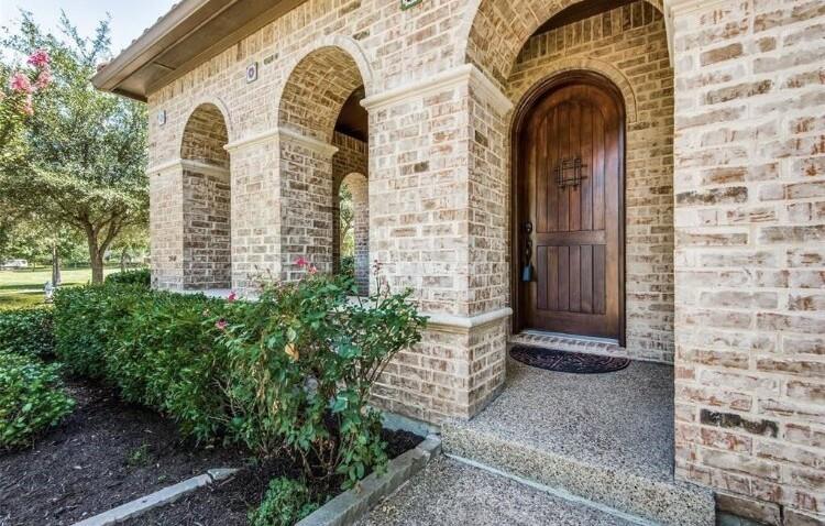 6821 Camino Rio Irving, TX 75039 - Photo 3 of 20 a front view of a house with garden