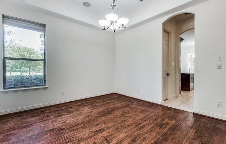 6821 Camino Rio Irving, TX 75039 - Photo 8 of 20 wooden floor in an empty room with a window