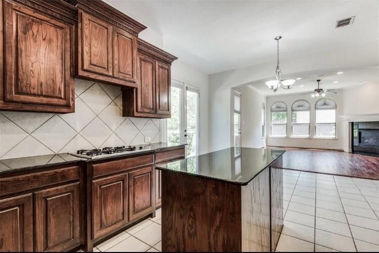 6821 Camino Rio Irving, TX 75039 - Photo 20 of 20 a kitchen with stainless steel appliances granite countertop a sink stove and cabinets