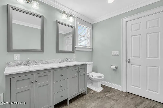 a bedroom with a bed and a ceiling fan