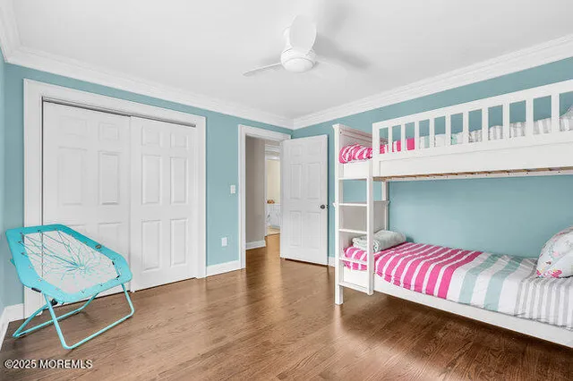 a view of a room with wooden floor and staircase