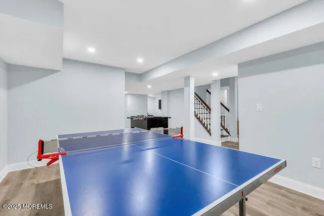 a an empty room with stairs and a ceiling fan